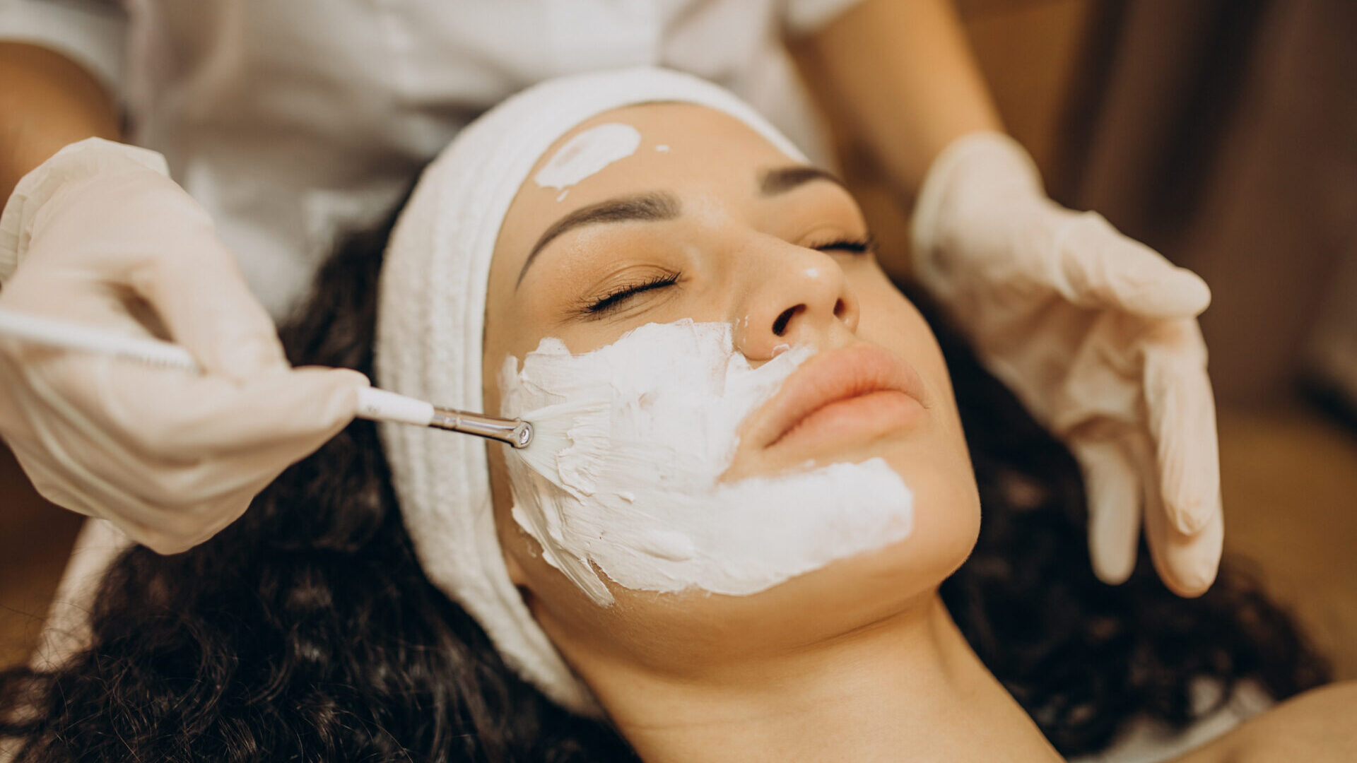 Woman visiting cosmetologist and making rejuvenation procedures